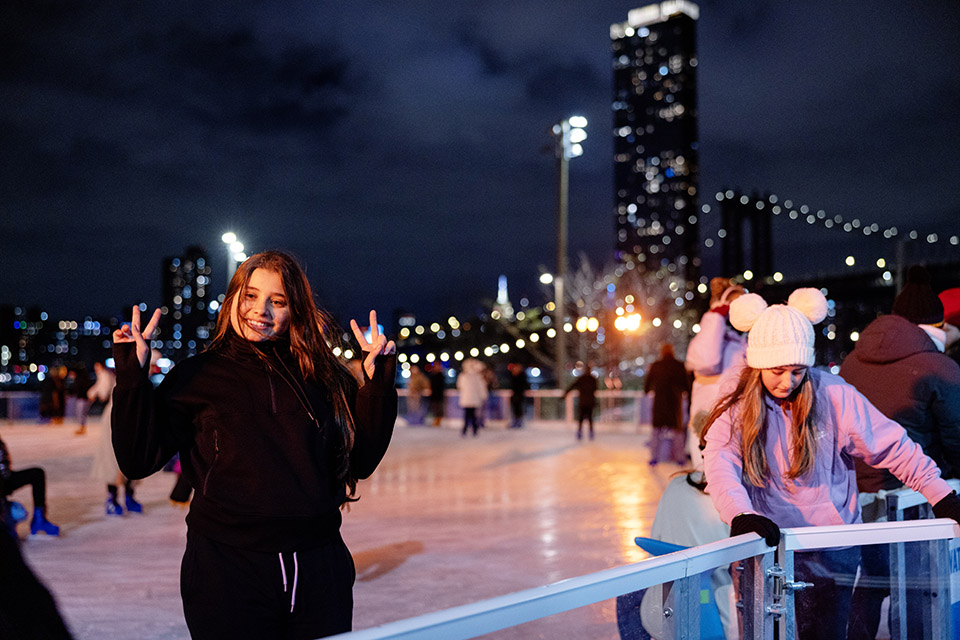 Roebling Rink at Brooklyn Bridge Park welcomes visitors to skate under an NYC landmark.