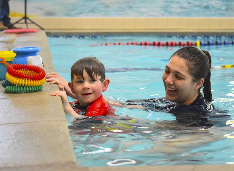 Beloved instructors make kids look forward to pool time! Photo courtesy of the Academy Swim Club