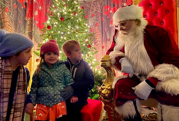 Kids pose with Santa at The Village at Anne Ellen