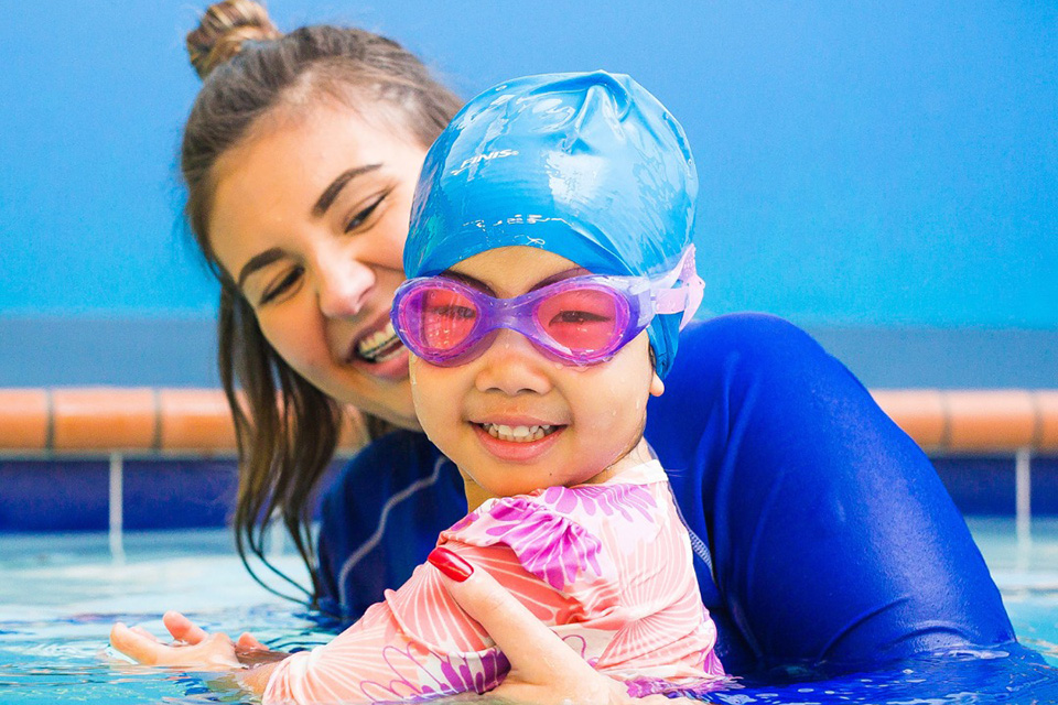 Learn to swim with mom at Aqua-Tots Swim Schools. Photo courtesy of the school