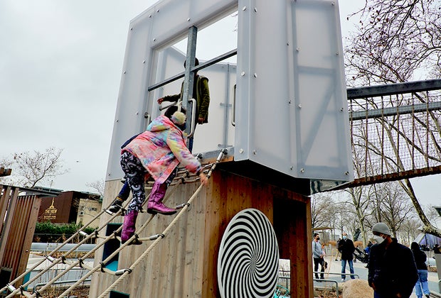 Girl climbing The Battery Playscape