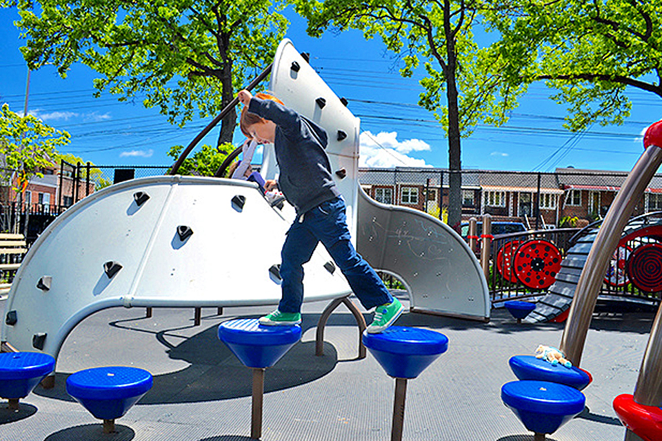 A top Queens playground, Paul Raimonda Playground offers sprinklers, climbing, and shady seating. Photo by author