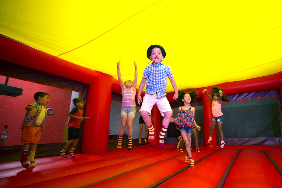 kids jumping in bouncy castle
