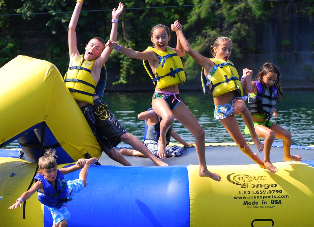 Bounce, splash, and make the most of summer at the best inflatable water parks in New England. Photo courtesy of Brownstone Adventure Sports Park