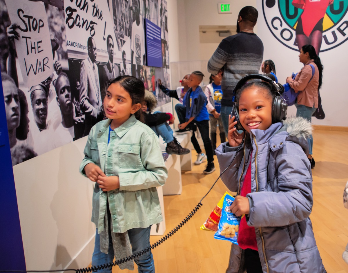 Kids check out the current exhibit at the CAAM. Photo by HRDWRKER
