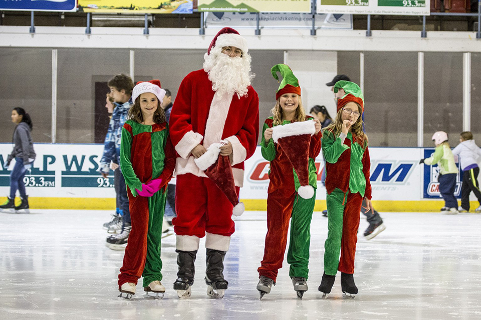 Holiday Village Stroll Santa and elves ice skating