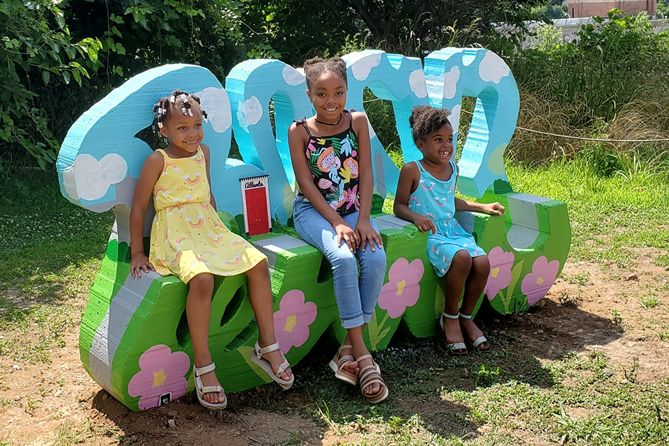 Take a photo at Tiny Doors ATL's door #6, featured in a custom bench by artist Ira Hill, located on the Beltline Eastside trail. Photo courtesy of Tiny Doors ATL