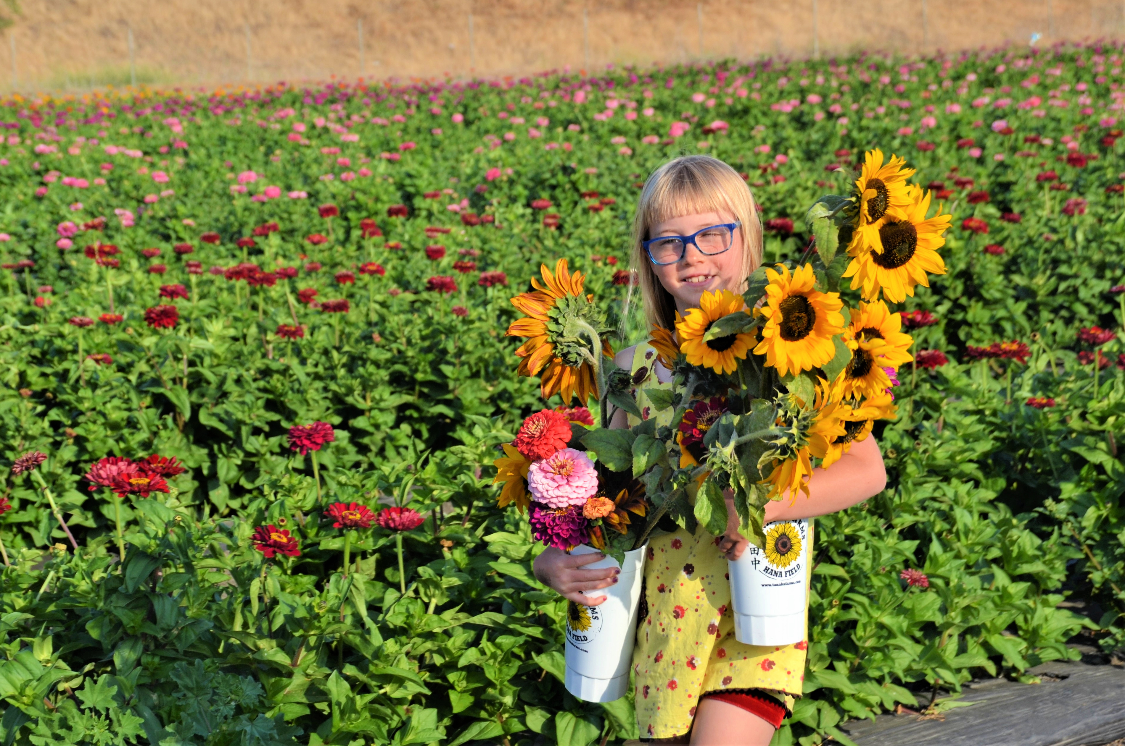 Flowers always bring smiles to little faces!