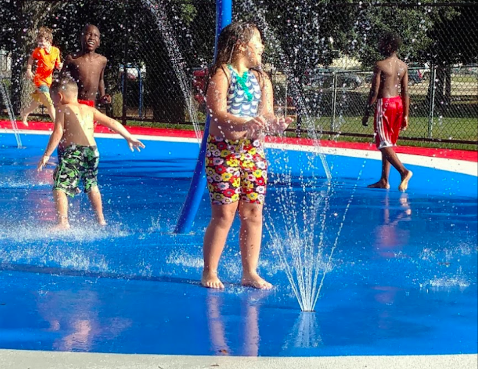 A recently renovated spray deck abuts a beloved free pool in Somerville's Foss Park. Photo courtesy of  Willene Ticianeli