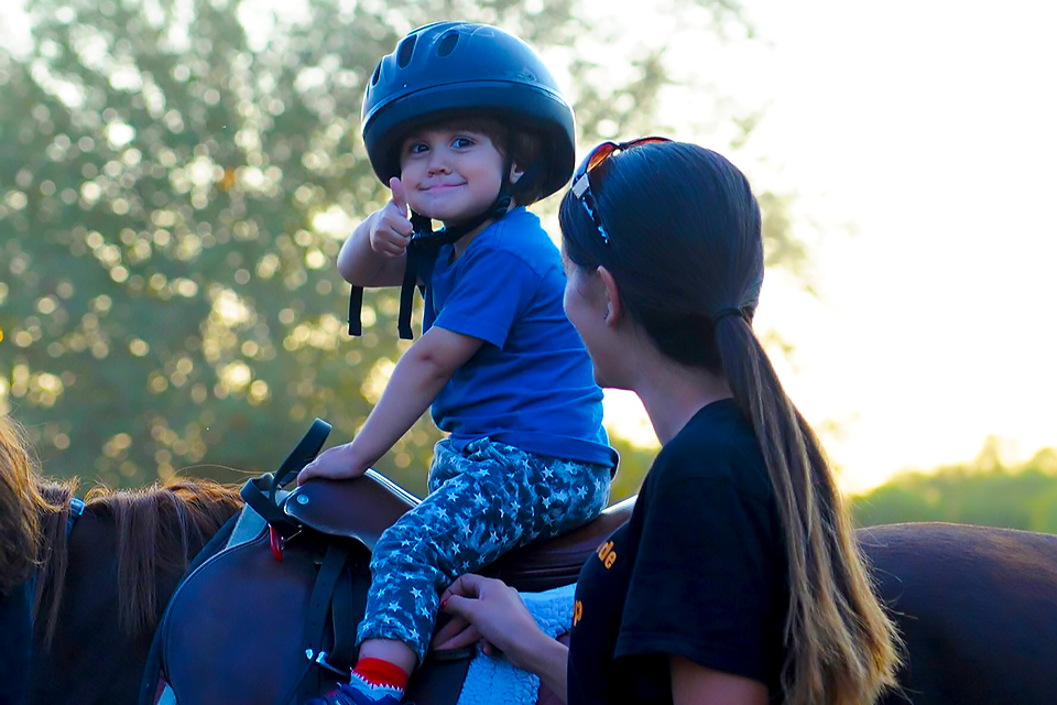 Gallop NYC uses therapeutic horsemanship to build developmental, emotional, social, and physical skills for each rider. Photo courtesy of Gallop NYC