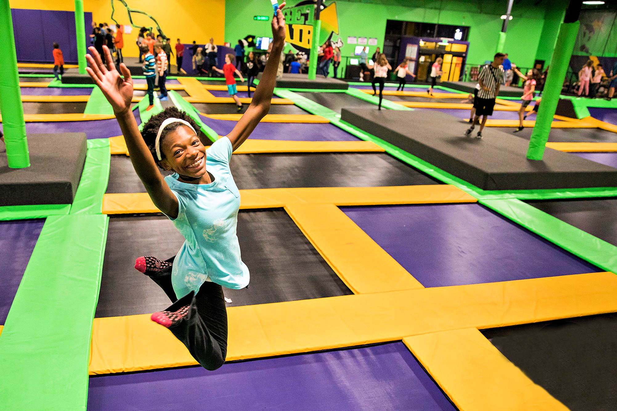 Raise your hand if you love visiting the best indoor trampoline parks in Connecticut! Photo courtesy of Get Air Sports
