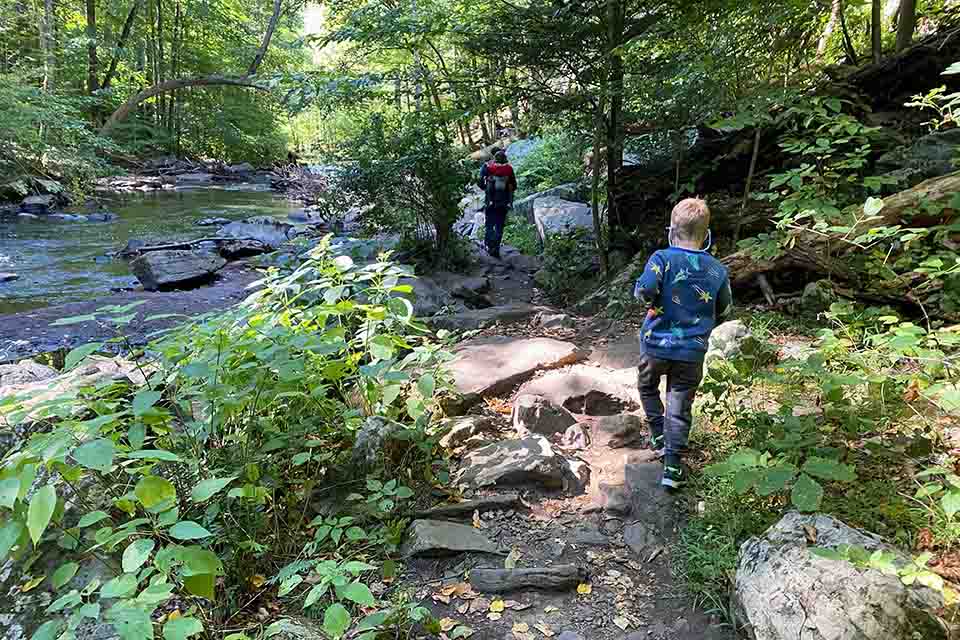 A family hikes alongside the Black River in New Jersey