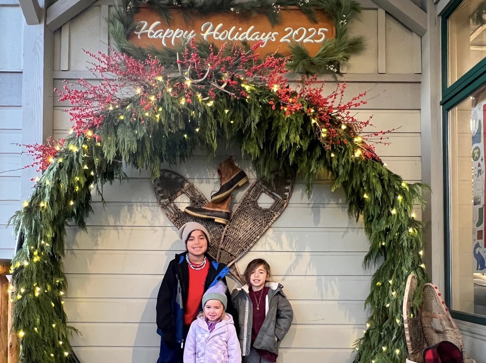 Image of children and holiday wreath - Christmas in Maine