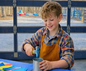 CMEE hosts a Tin Smithing workshop with Suffolk County Farms, where kids can enjoy old-fashioned fun. Photo courtesy of CMEE