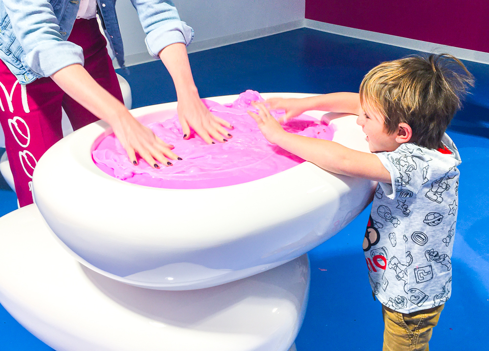 Kids can explore the slime at the Sloomoo Institute in Chicago. Photo by Lauren LaRoche