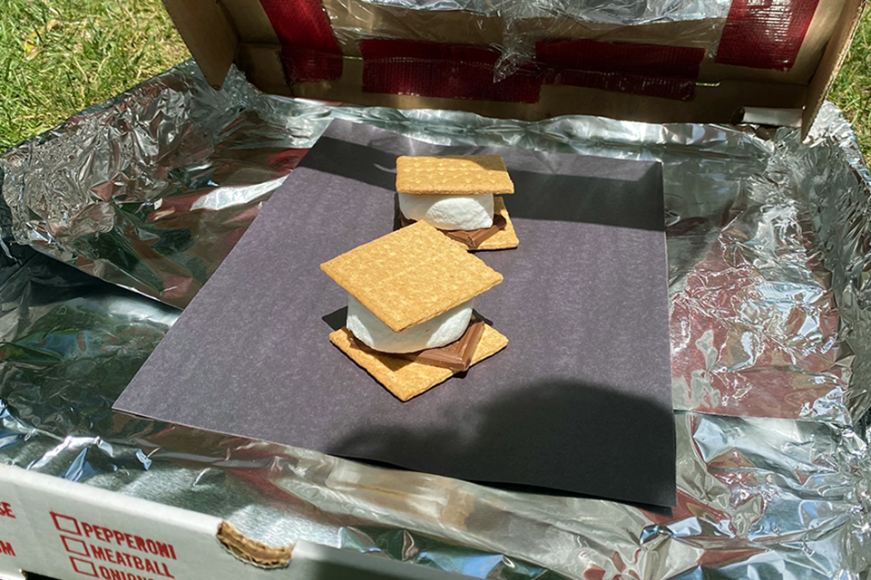 This solar oven science experiment offers one tasty reward: ooey, gooey s'mores.