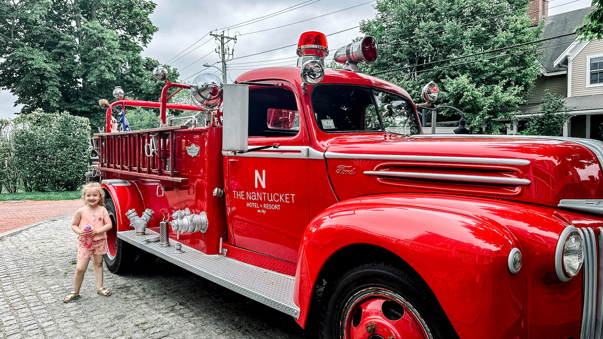 Image of child next to fire engine - Visiting Nantucket