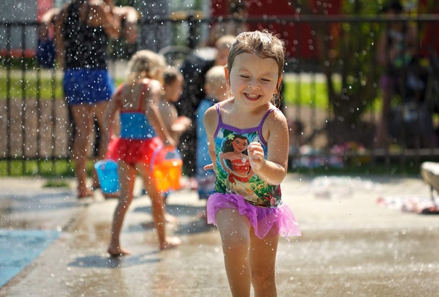 Photo of child running through splash pad at Longbrook Park, Stratford, CT
