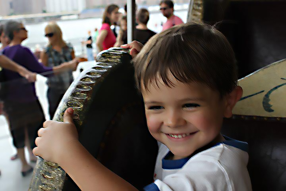 It's all smiles at Jane's Carousel in Brooklyn Bridge Park. Photo by Megan Newhart