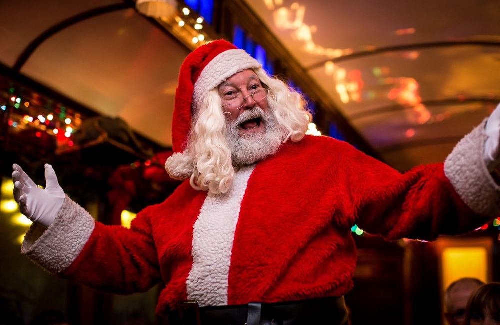 Santa greets families on the daytime Santa Express and the evening Northern Lights Limited Christmas trains. Photo courtesy of the Naugatuck Railroad