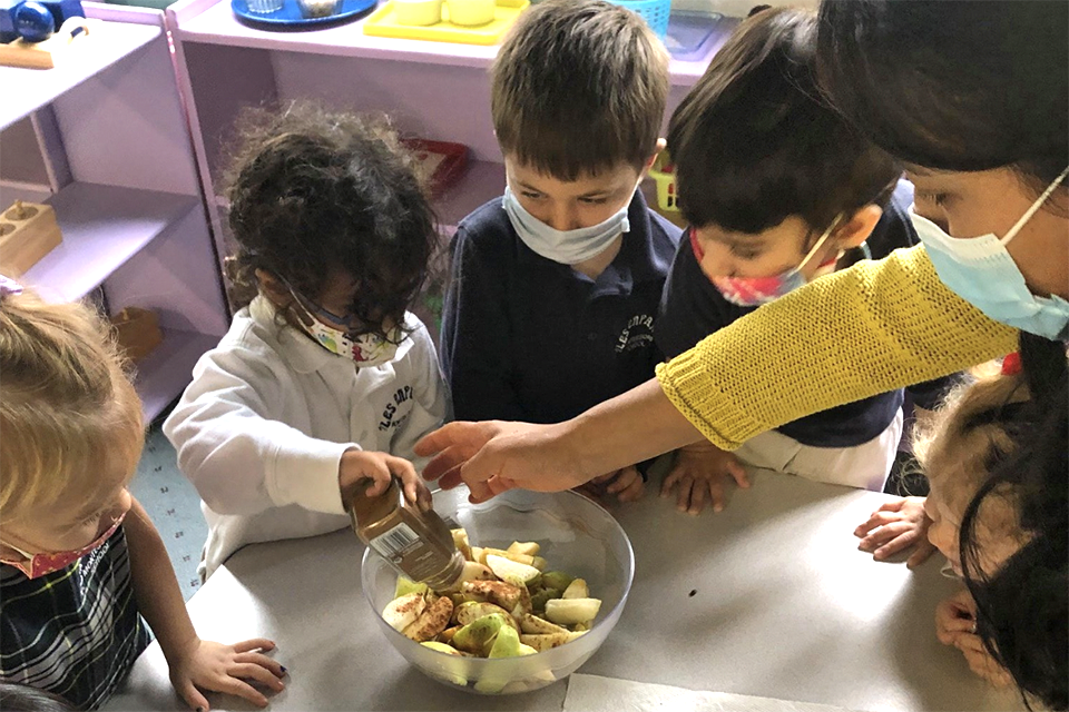 Teamwork and friendship are core values at Les Enfants Montessori School. Photo courtesy of the school