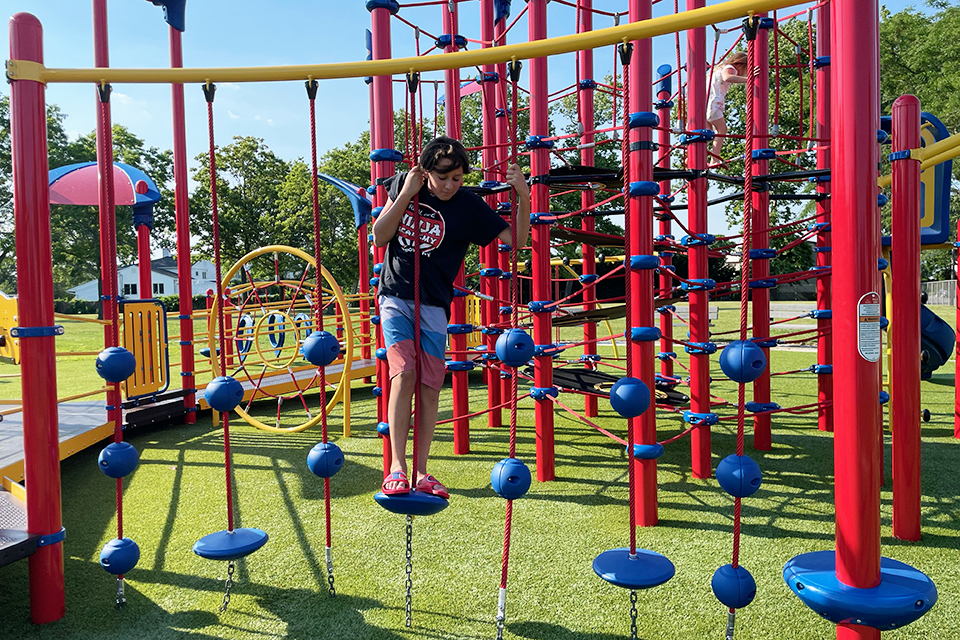 Newbridge Road Park Playground boys on a ropes course on a park playground