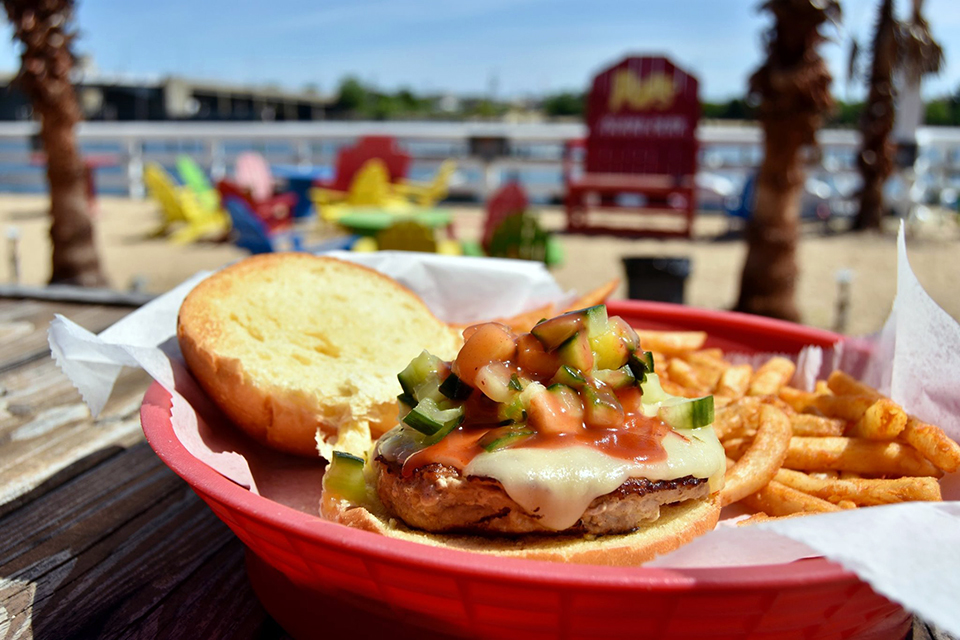 Enjoy the tropical island atmosphere at Pop's Seafood Shack and Grill in Island Park.