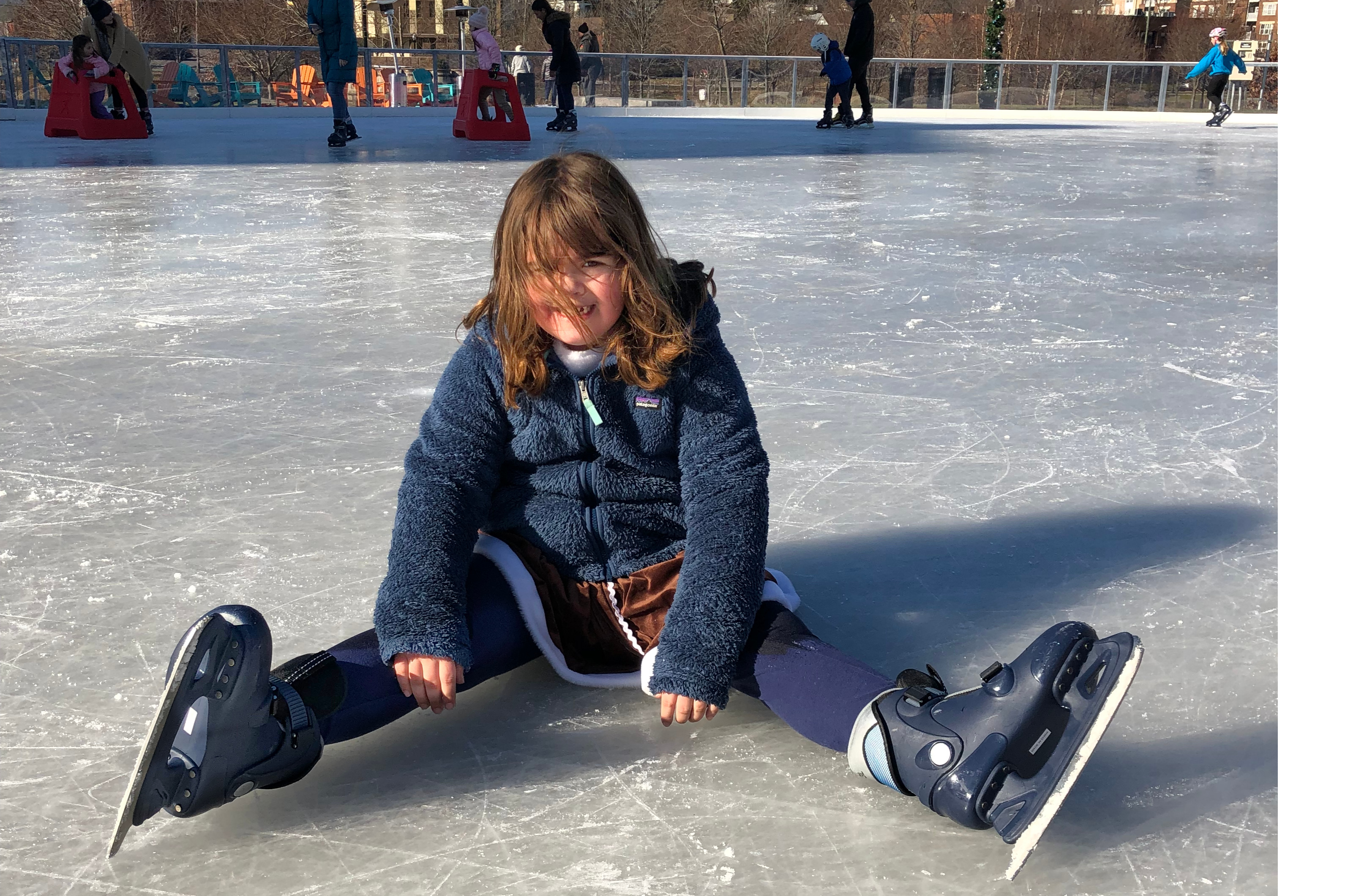 image of child sitting on ice-Best outdoor ice skating rinks in Connecticut