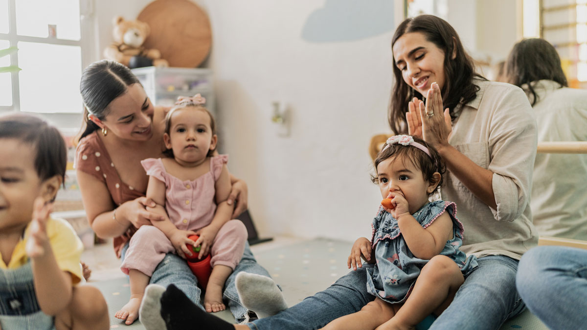 Two toddlers enjoying mommy-and-me-classes. Photo courtesy iStock