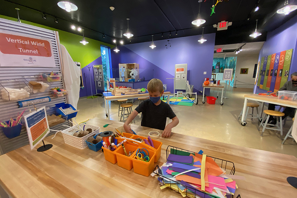 Boy at the Vertical Wind Tunnel Station at Spark!Lab at the Morris Museum