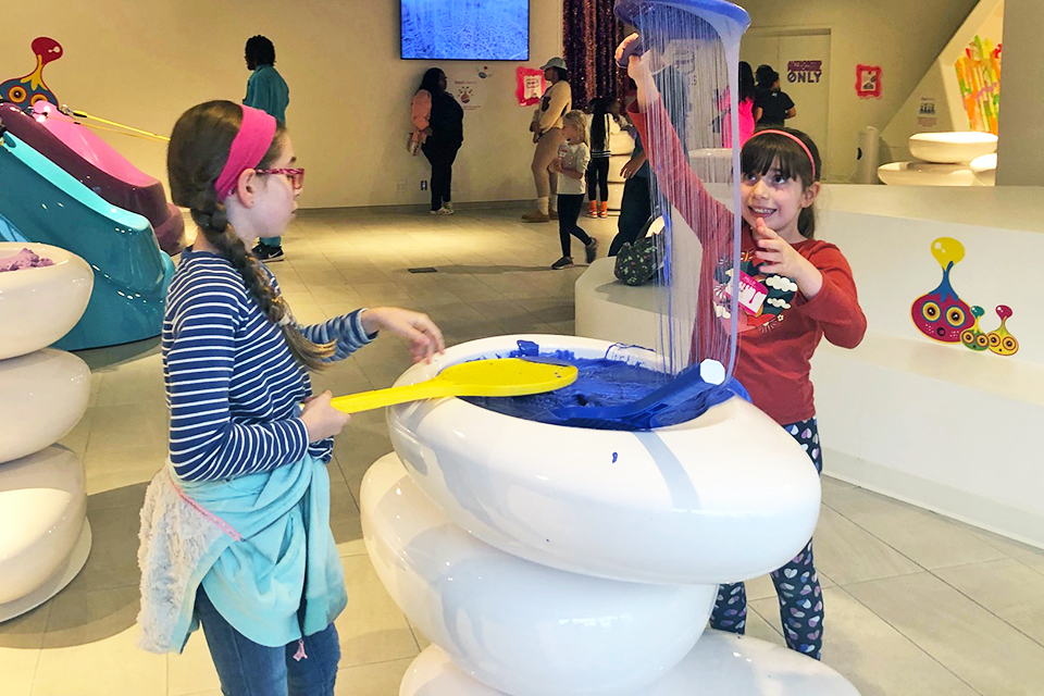 Kid-Friendly Science Museums in Atlanta: girls playing with slime at the SlooMoo Institute