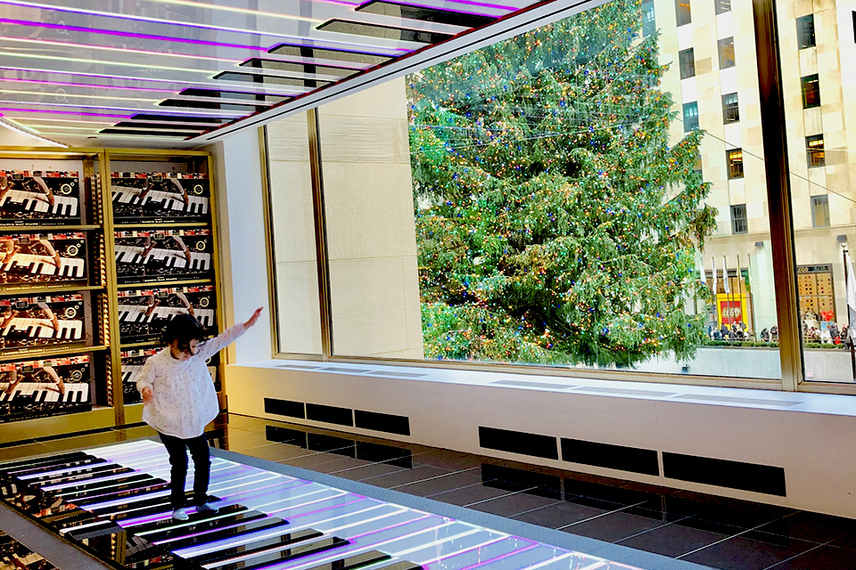 Play a tune on the piano mat at FAO Schwarz. Photo by Janet Bloom