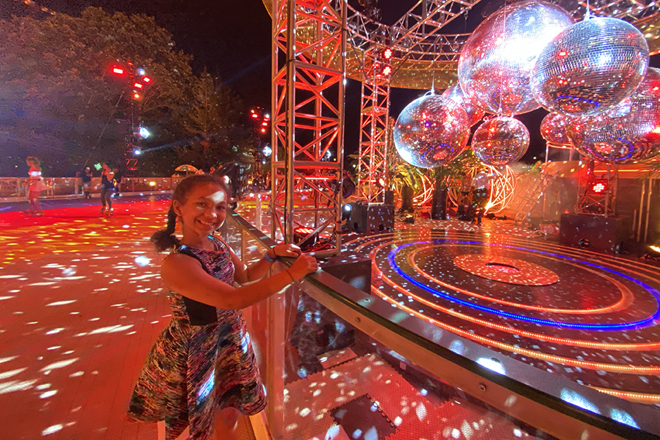 The DiscOasis in Central Park girl with disco balls