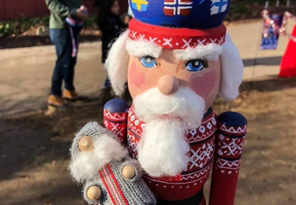 Enjoy the holiday carnival atmosphere in Mystic complete with stilt walkers, a brass band, and Santa's workshop. Photo courtesy of Olde Mistick Village