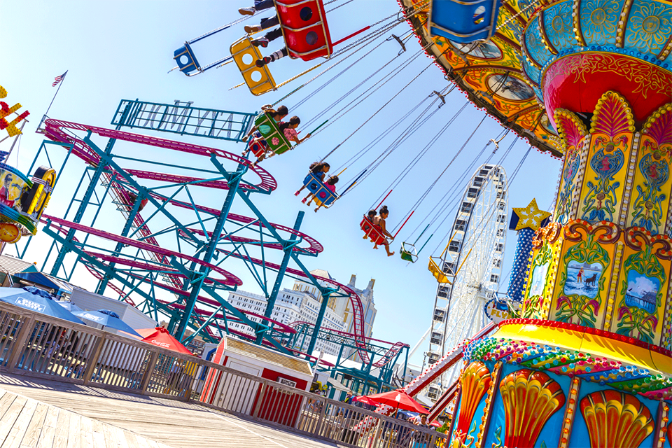 Hop on the nostalgic rides located right on the boardwalk in Daytona Beach. Photo courtesy of Mommy Poppins