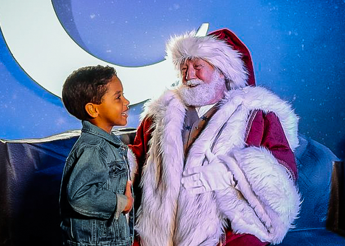 Meet Santa amid dazzling lights. Photo courtesy of Enchant Christmas 