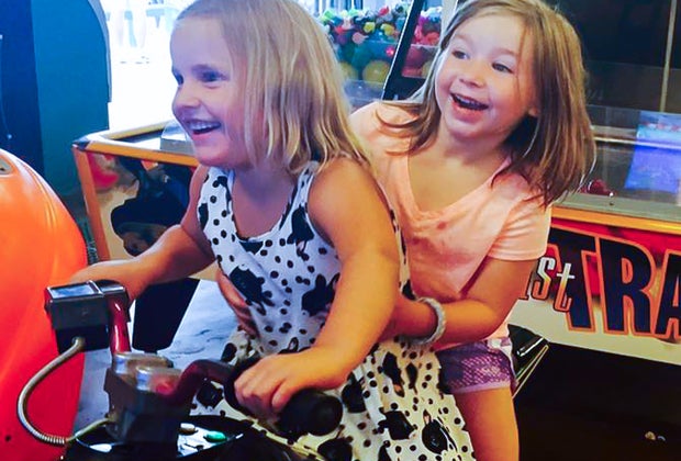 Image of girls on an arcade game - Best Arcades in Boston
