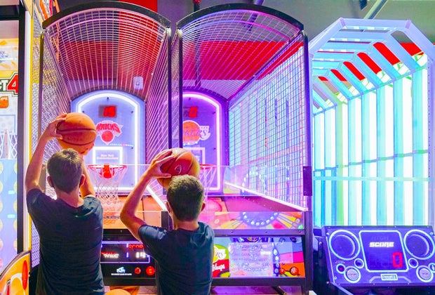 Photo of two kids at a basketball-themed arcade game in CT.