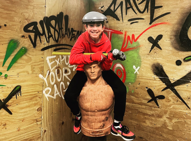 Photo of child with sledgehammer at Foxwoods Resort's Smash Avenue