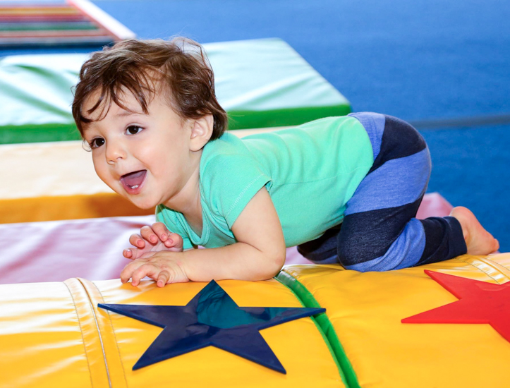 Photo of toddler on a gym mat - Things To Do with Preschoolers in CT