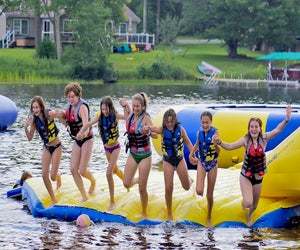 Inflatables on the lake at Camp Chen-A-Wanda. Photo courtesy of the camp