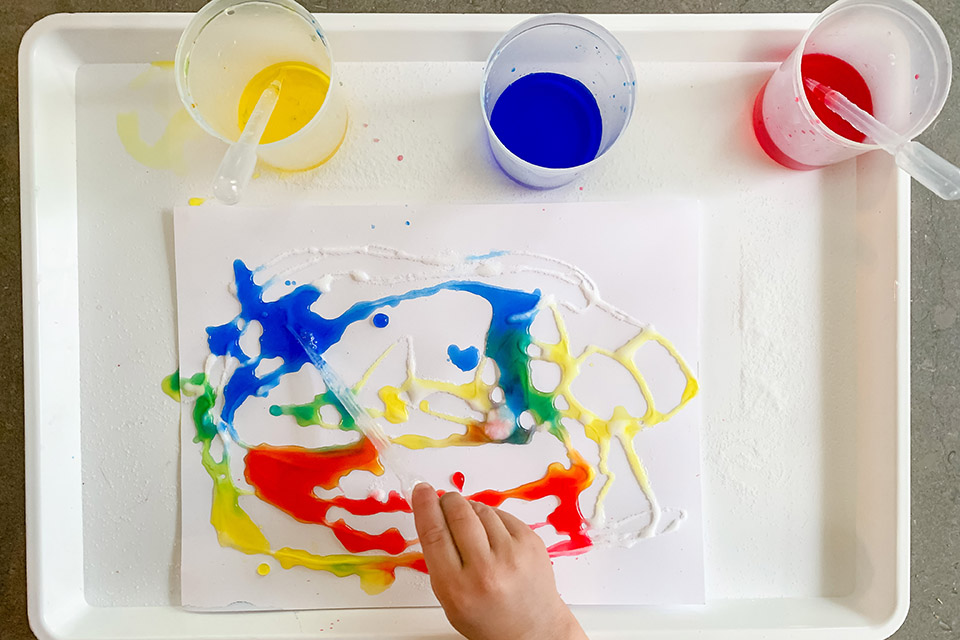 Rainbow salt gule painting has lots of steps to keep kids from being bored.