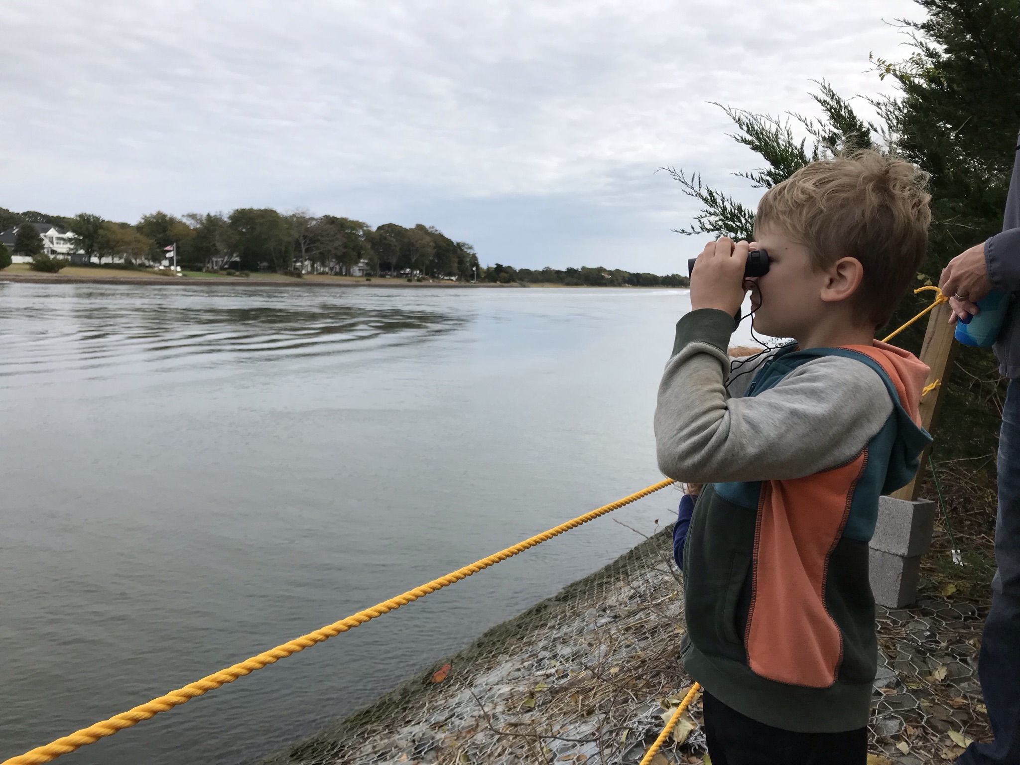 Boy looks through binoculars
