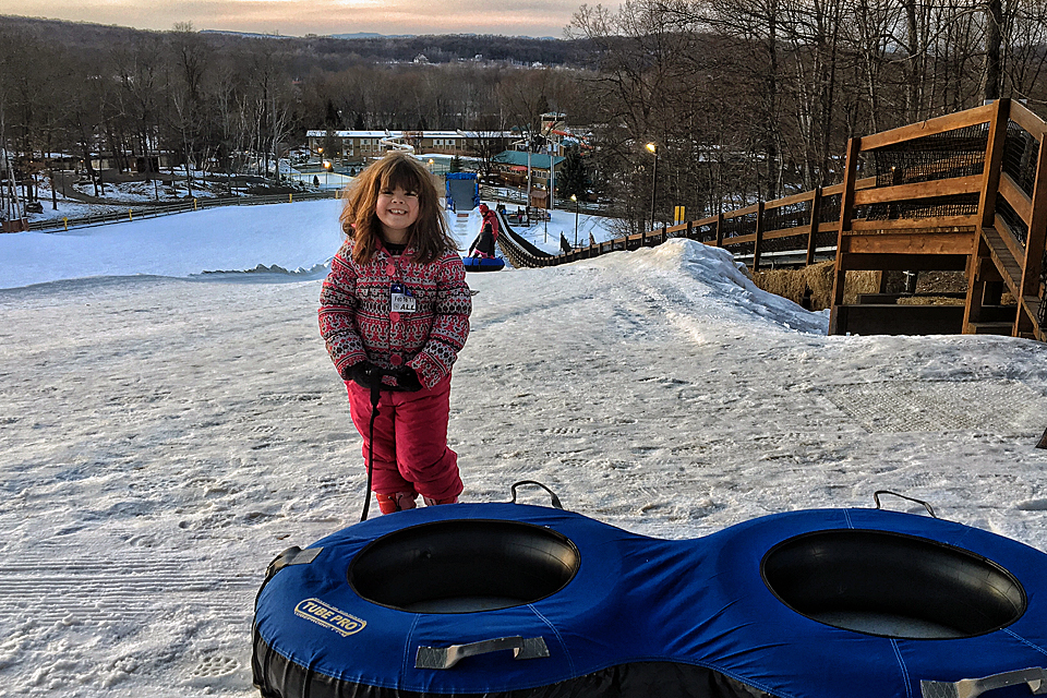 Snow tubing is one of many fun winter activities to enjoy at the all-seasons Rocking Horse Ranch with kids. 