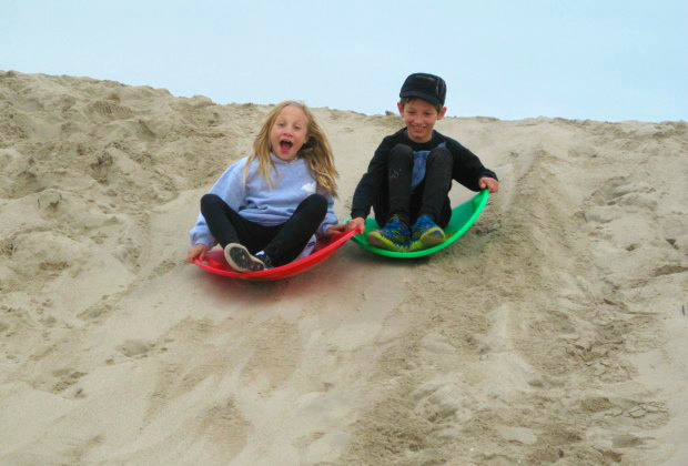 Sand sledding kids at Venice Beach