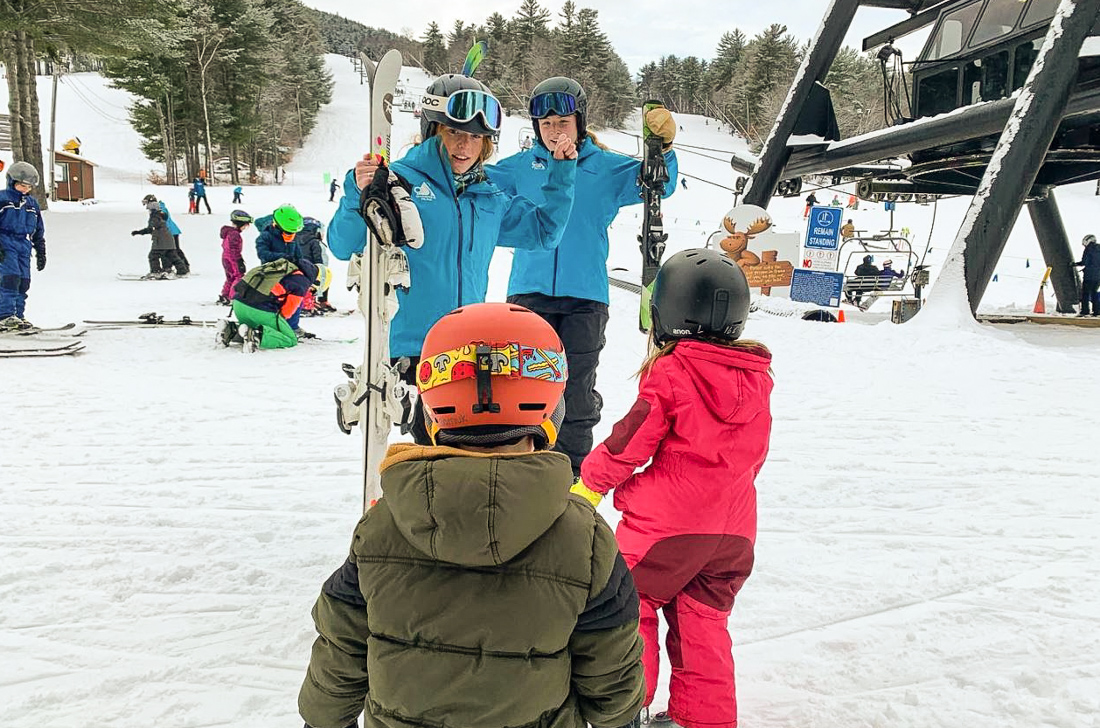 Photo of family near chair lift at a New England ski resort.
