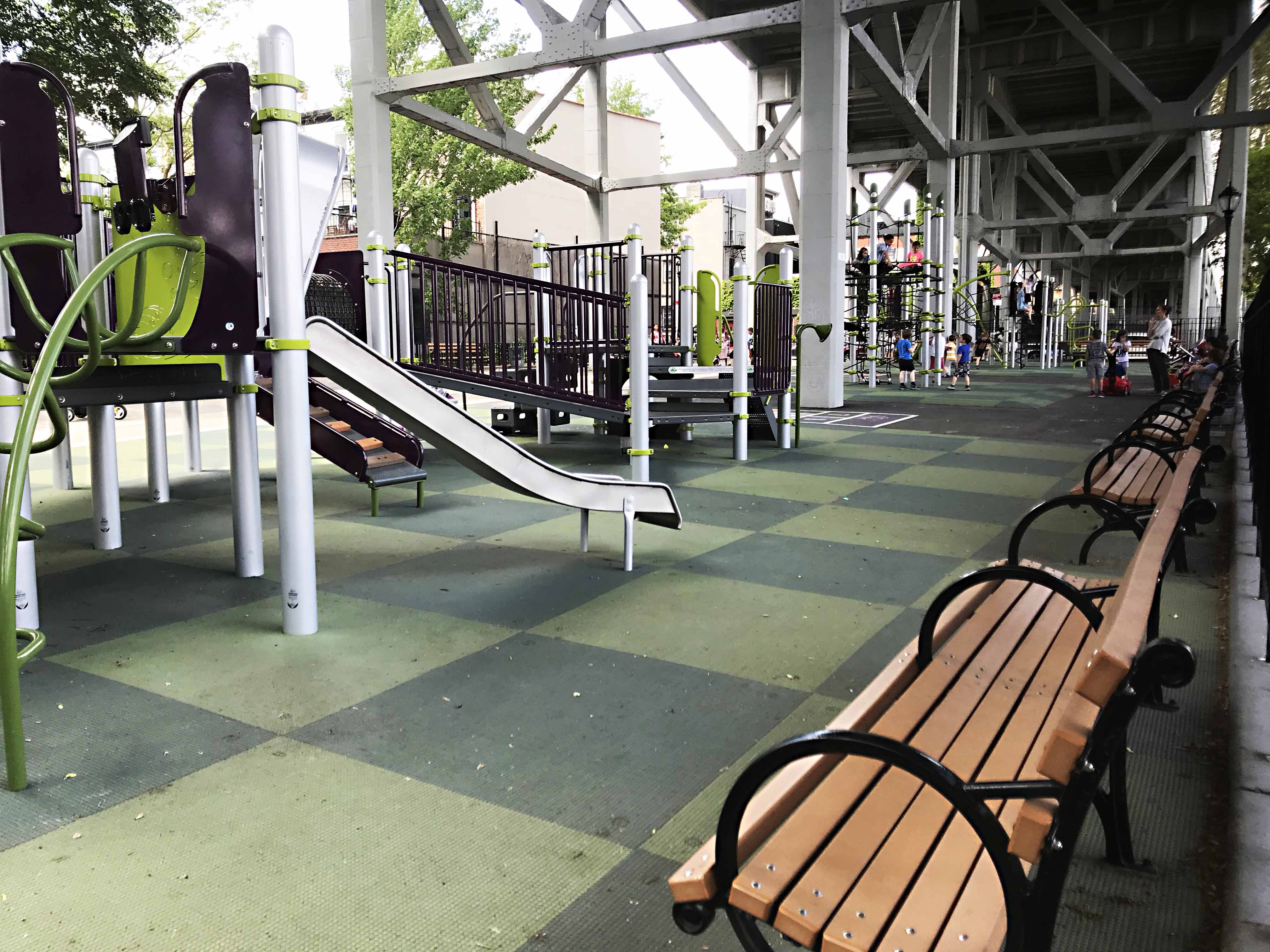 St. Mary's Park in Carroll Gardens is tucked in the shade beneath train tracks. Photo by Jeffrey Locke