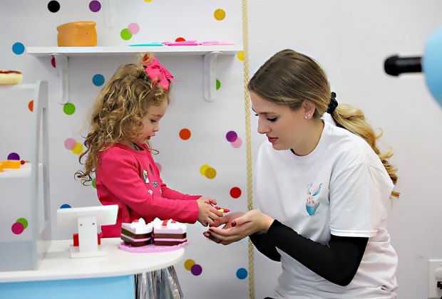 Have a slice of cake in the kitchen at A latte Fun. Photo by Russ Miskiewicz