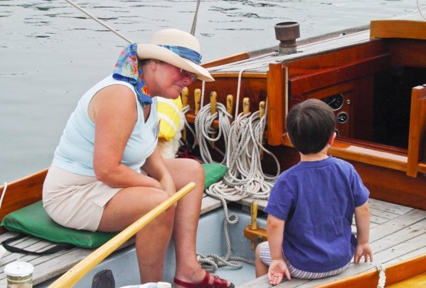 Kids get up close to some special classic boats in Salem. Photo courtesy of the Antique & Classic Boat Festival