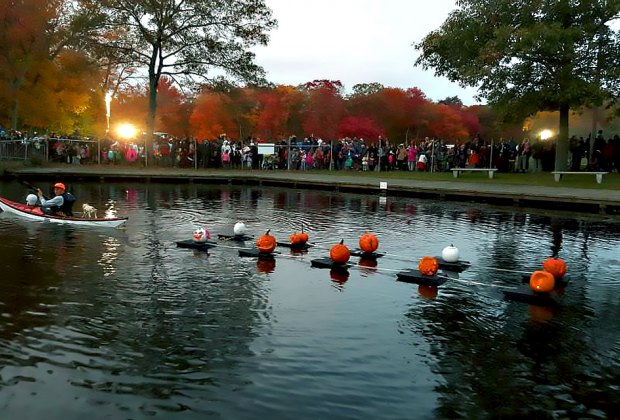 Jack-o'-lanterns alight on Belmont Lake during the Great Jack-o'-Lantern Spectacular Sail. Photo courtesy of Long Island State Parks and Recreation